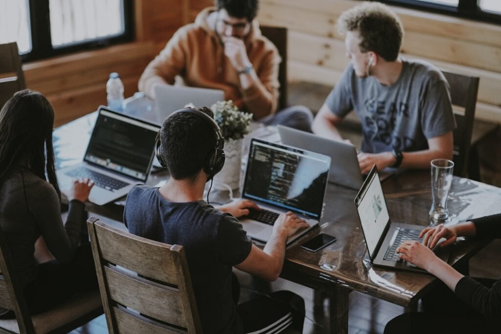 Colleagues collaborating around a table in an open-plan office