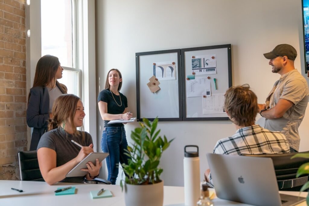 Team reviewing a system diagram on a collaboration whiteboard
