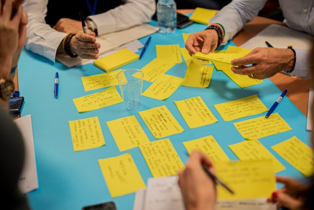 Programme team gathered around a planning wall of notes